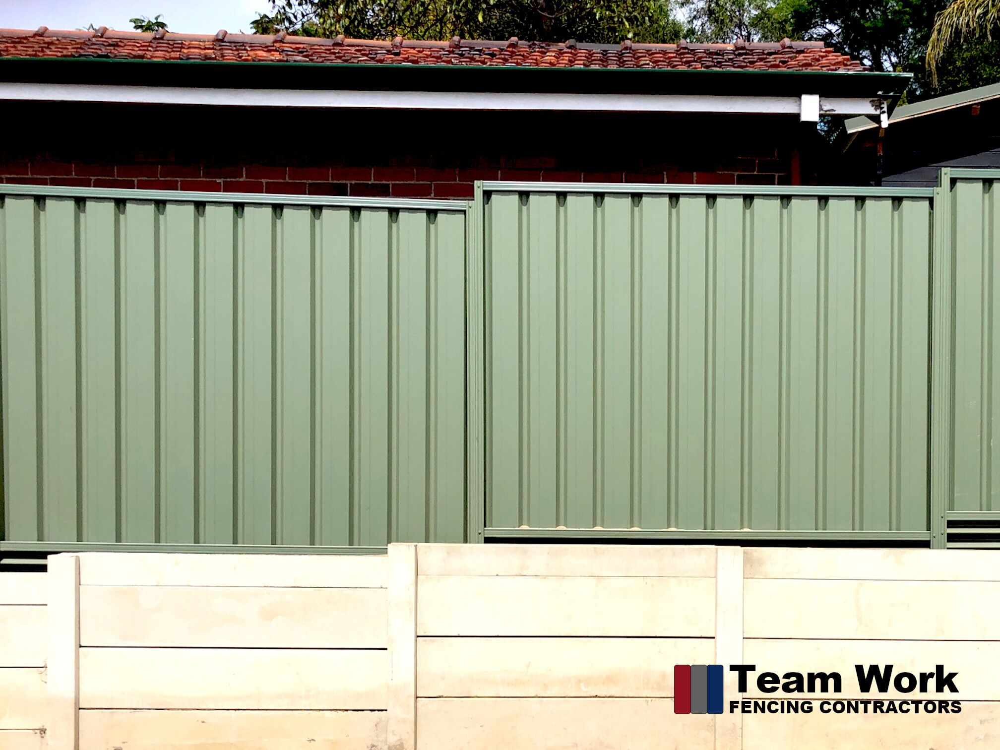 Green Colorbond Fence with Allywall Retaining