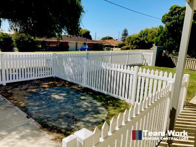 Traditional white PVC picket fencing and gate installation in Rockingham, Perth WA