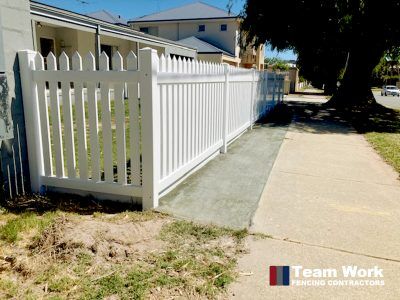 Traditional white PVC picket fencing and gate installation in Rockingham, Perth WA