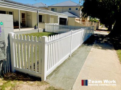 Traditional white PVC picket fencing and gate installation in Rockingham, Perth WA
