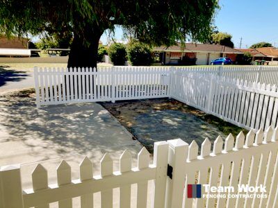 Traditional white PVC picket fencing and gate installation in Rockingham, Perth WA